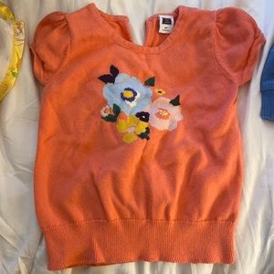 Janie and Jack orange SS sweater 2T flower detail on front. 100% cotton.